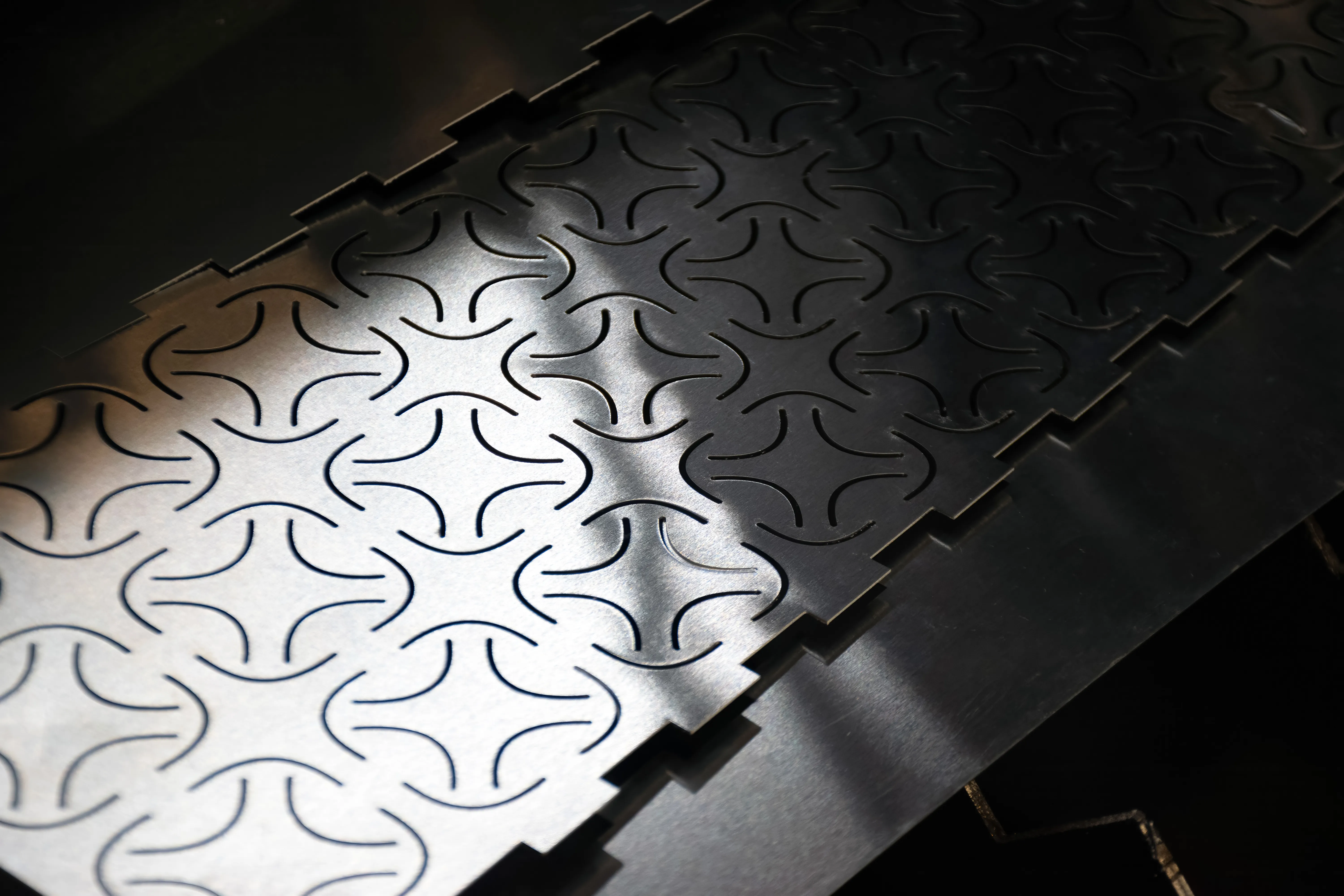 A laser-cut aluminum sheet.